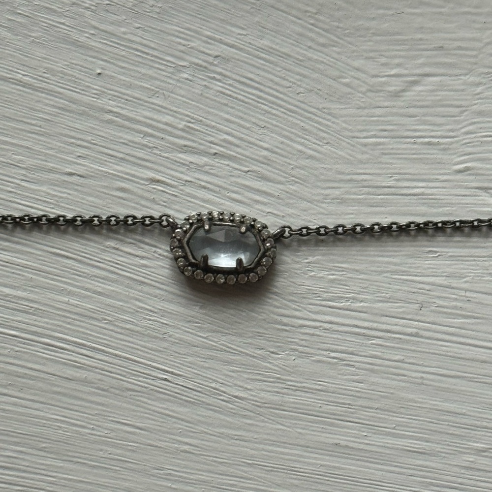 Kendra Scott silver pendant necklace.